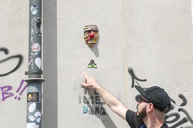 Alternative Bucharest Walking Tour - Looking at street art beside ordinary life