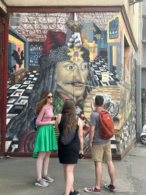 Bucharest Alternative Walking Tour - The old Square Cat mural and Cinema Capitol Garden